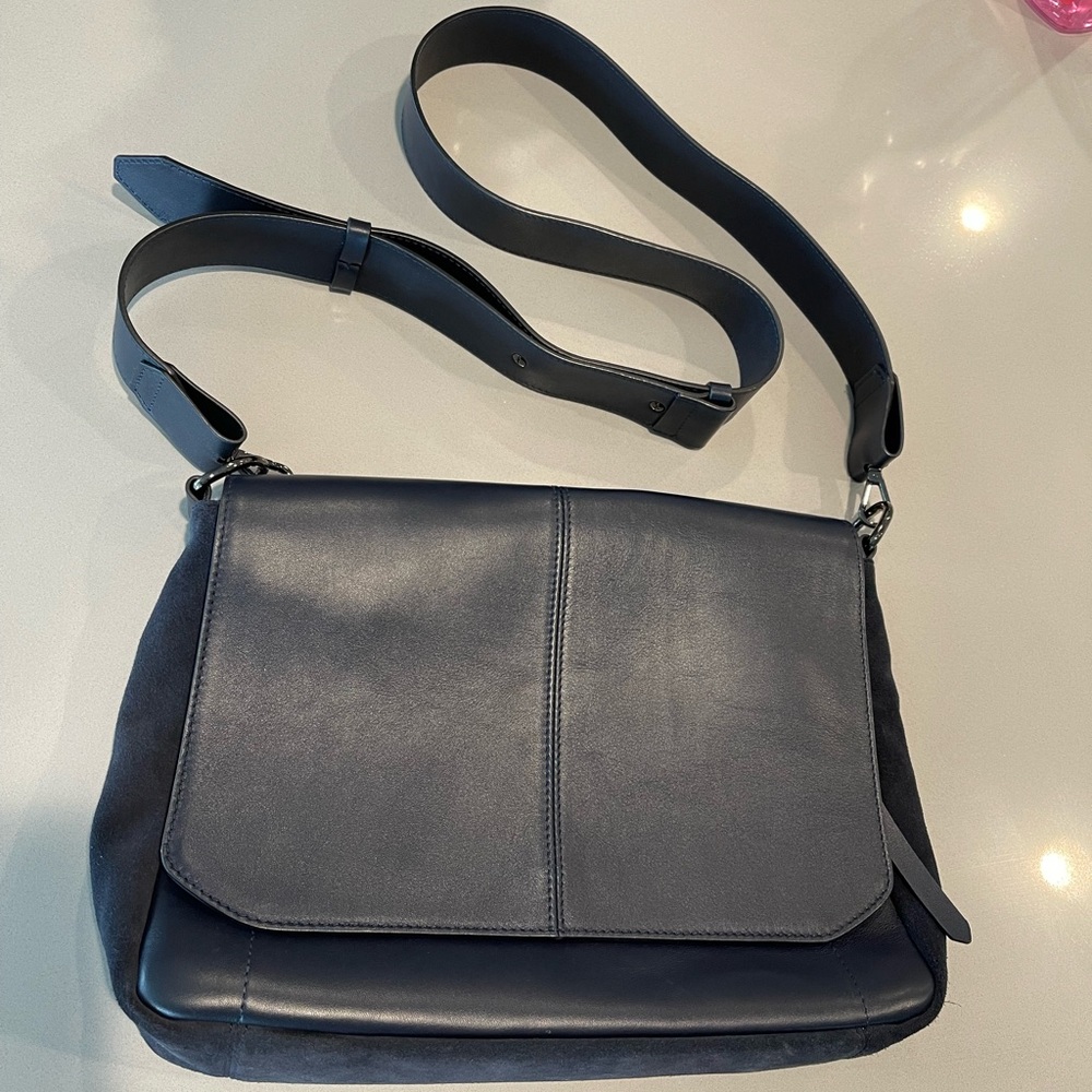 Beautiful Aquatalia navy blue leather bag with suede detail on the sides.